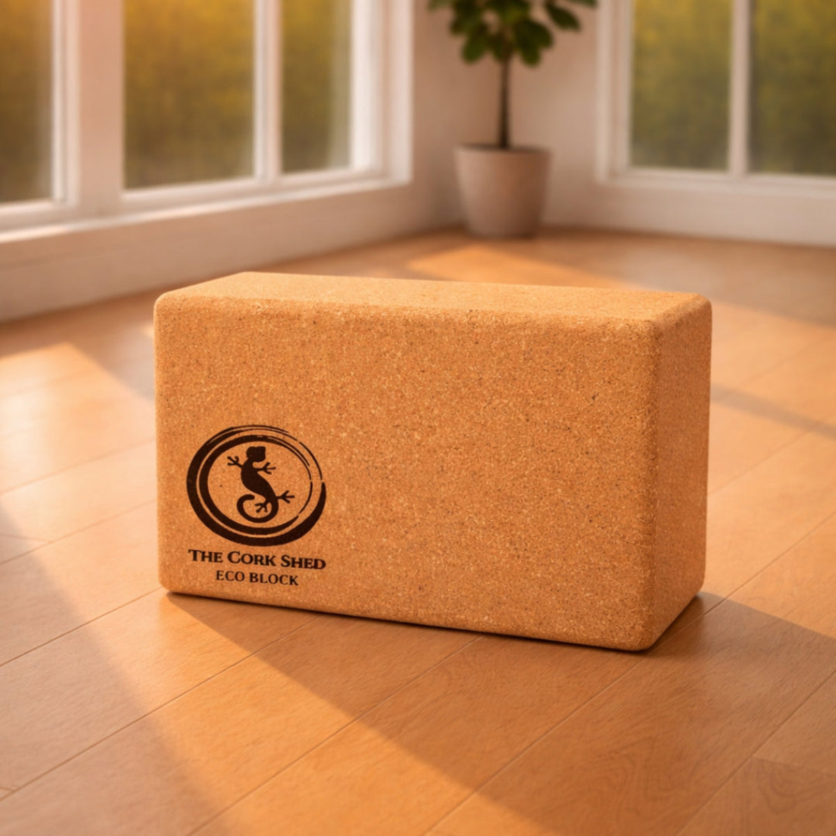 Cork yoga block with 'The Cork Shed' logo on a wooden floor.