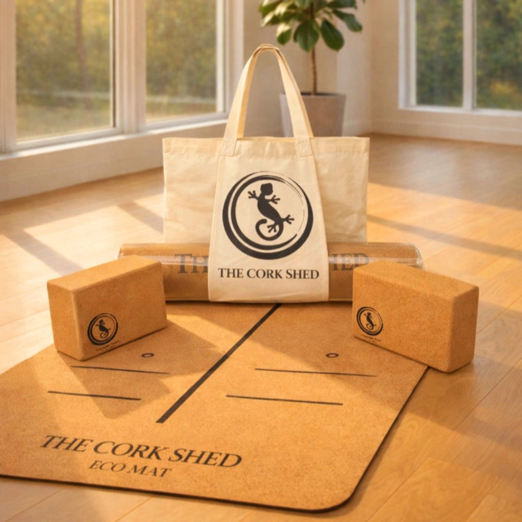 Yoga mat, blocks, and tote bag with 'The Cork Shed' logo on a wooden floor.